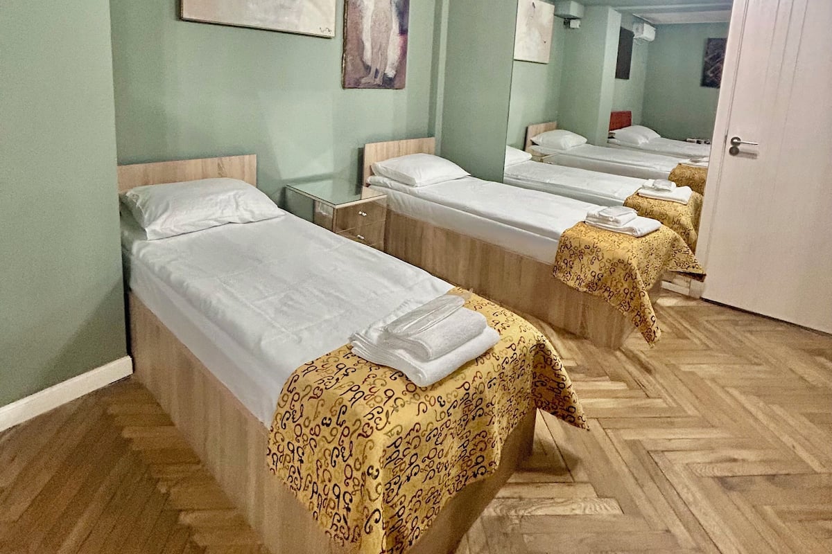 Family Quadruple Room, Garden View | In-room safe, soundproofing, iron/ironing board, free WiFi