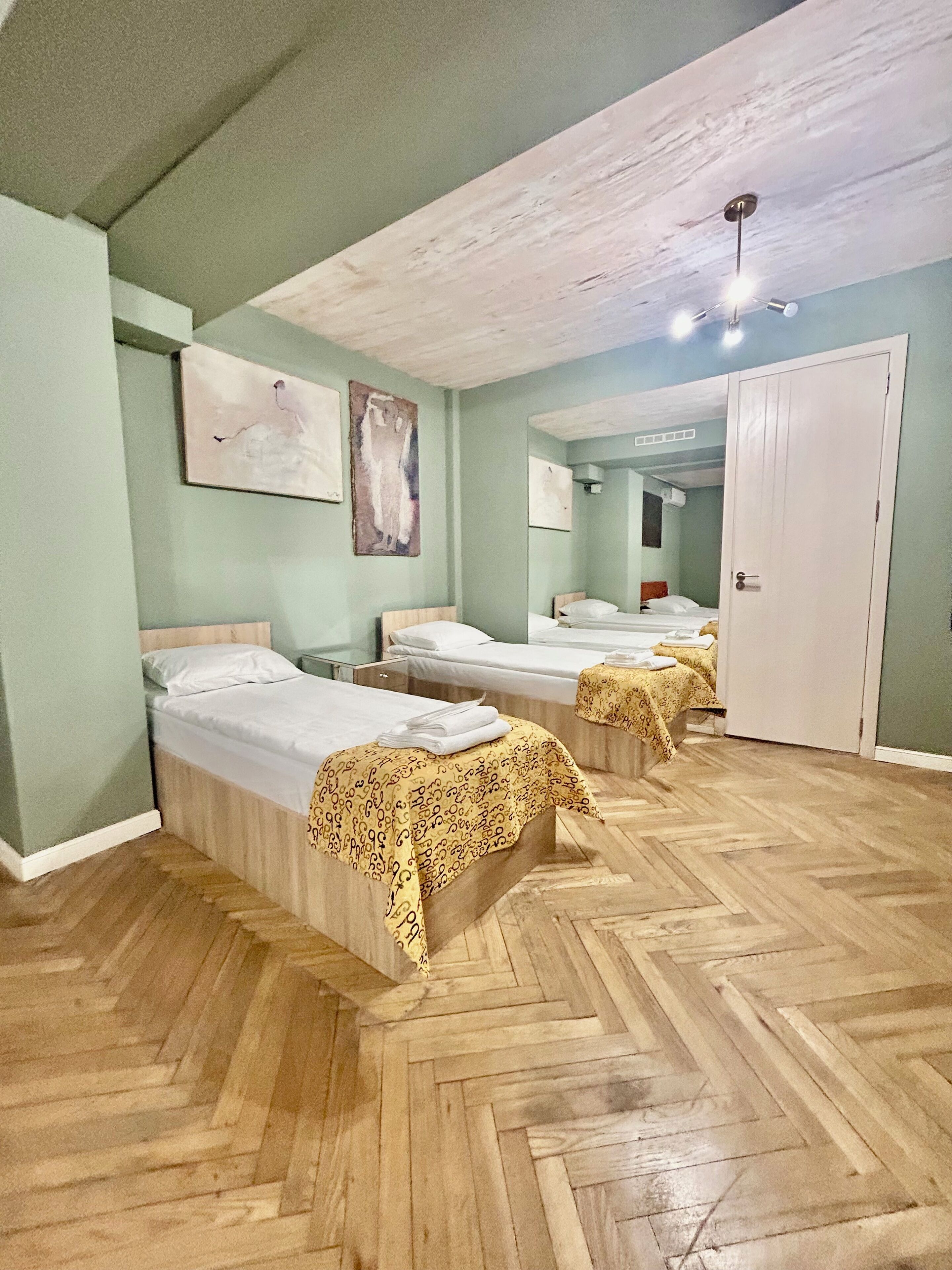 Family Quadruple Room, Garden View | In-room safe, soundproofing, iron/ironing board, free WiFi