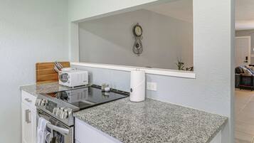 Fridge, microwave, stovetop, coffee/tea maker