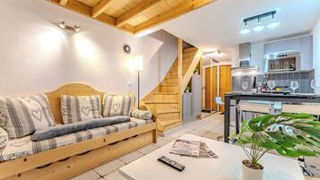 Deluxe Apartment, Balcony, Garden View | Living area | 33-inch Smart TV with digital channels