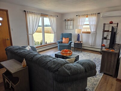 Family friendly, 1960's farmhouse on grain farm with AC in rural setting.