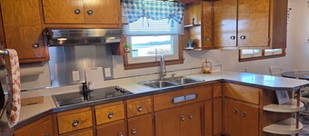 Family friendly, 1960's farmhouse on grain farm with AC in rural setting.