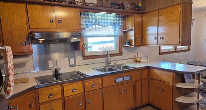 Family friendly, 1960's farmhouse on grain farm with AC in rural setting.