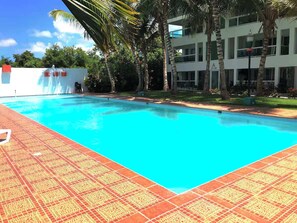 Outdoor pool, a heated pool - Peaceful 2-bedroom apartment with AC in Punta Cana, Oasis by the beach. (Punta Cana)
