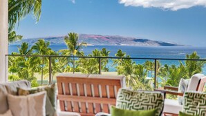 A balcony with a view of the ocean and palm trees. - Wrap-Around Ocean Views | Wailea Beach Villas PH301 (Wailea)