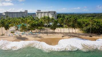 On the beach, sun loungers, beach umbrellas, beach towels