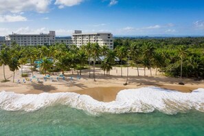 On the beach, sun loungers, beach umbrellas, beach towels
