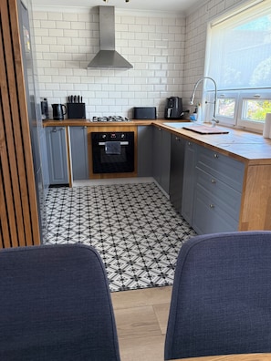 Microwave, oven, stovetop, dishwasher - Tranquil 2 bedroom home featur an open-plan living area and outdoor courtyard. (Hallett Cove)