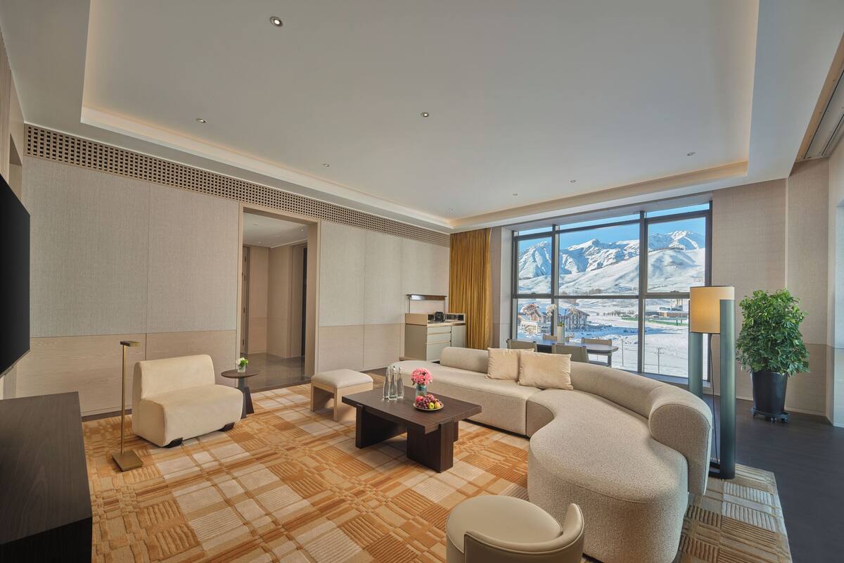 Premium Suite, 1 King Bed | Living area | 65-inch LED TV with cable channels, heated floors