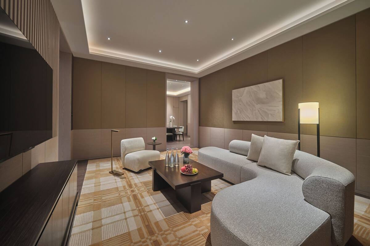 Deluxe Suite, 2 Double Beds | Living area | 65-inch LED TV with cable channels, heated floors