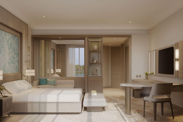 Une chambre d’hôtel moderne équipée d’un grand lit, d’un bureau, d’une chaise et d’un téléviseur.