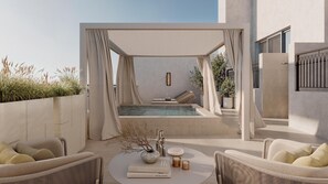 Un espace de détente extérieur moderne, doté d’une piscine, de sièges et d’un livre.