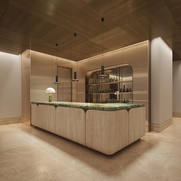 A modern kitchen with a central island, pendant lighting, and built-in appliances.