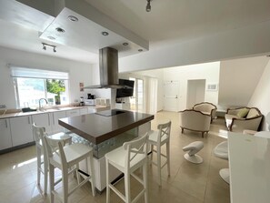 Penthouse, Pool View | Private kitchen | Fridge, coffee/tea maker, cookware/dishes/utensils, dining tables - BAVARO SEASIDE Villas BEACH HOTEL & SPA (Punta Cana)