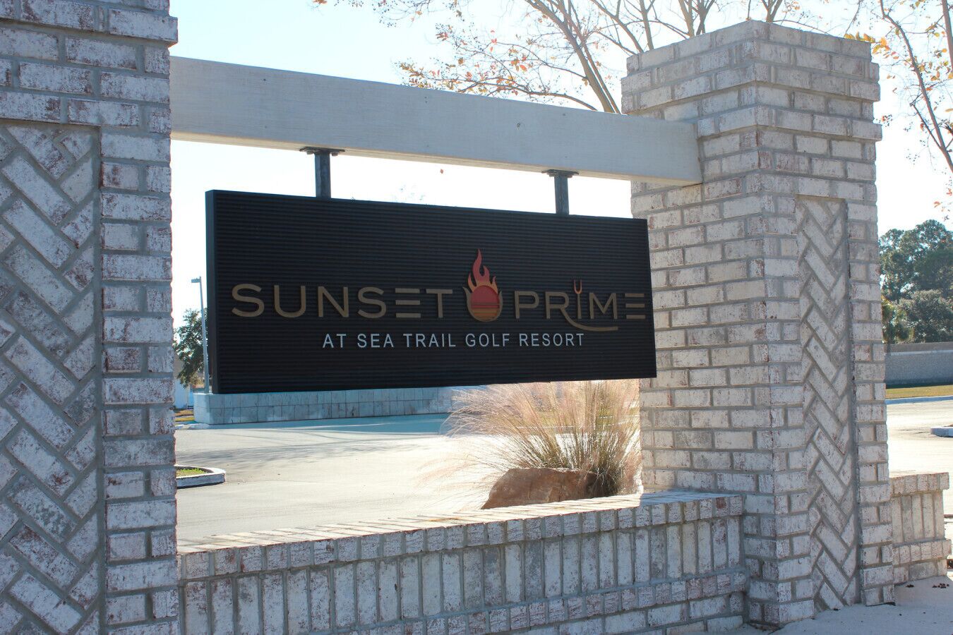 A sign for Sunset Prime at Sea Trail Golf Resort.