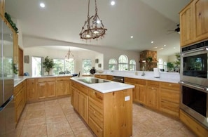 Fridge, microwave, oven, stovetop - Luxury Forest Retreat near USAFA–6 bedrooms, 5 bathrooms, Indoor Pool & Theater (Colorado Springs)