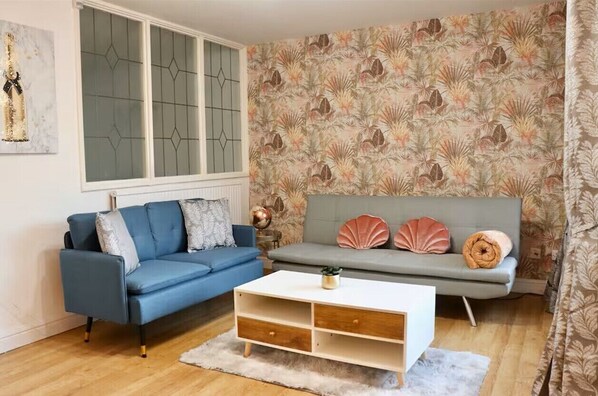 Appartement Confort, vue jardin | Coin séjour