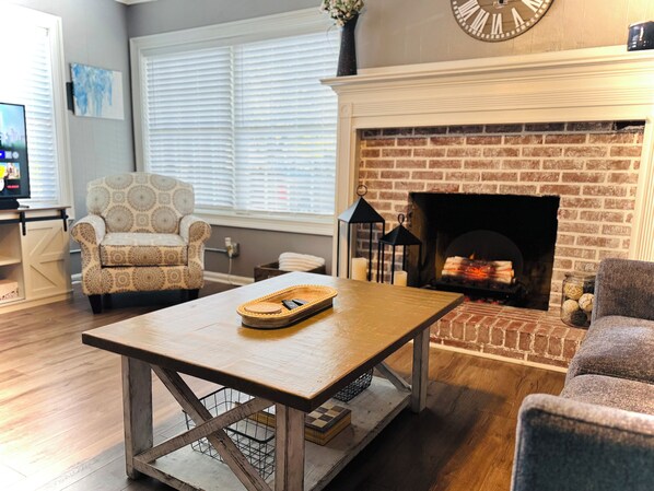 Smart TV, fireplace, books