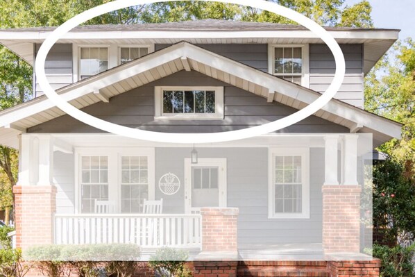 A two-story house with a front porch, a chimney, and a small window on the upper floor. - Boutique Private Apt Walk to Downtown Florence (Florence)