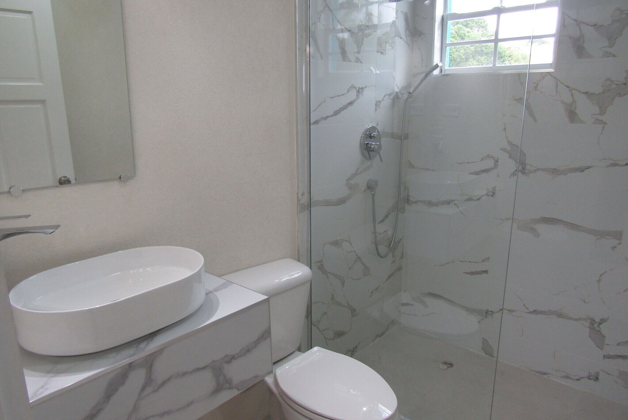 Shower, hair dryer, towels, shampoo