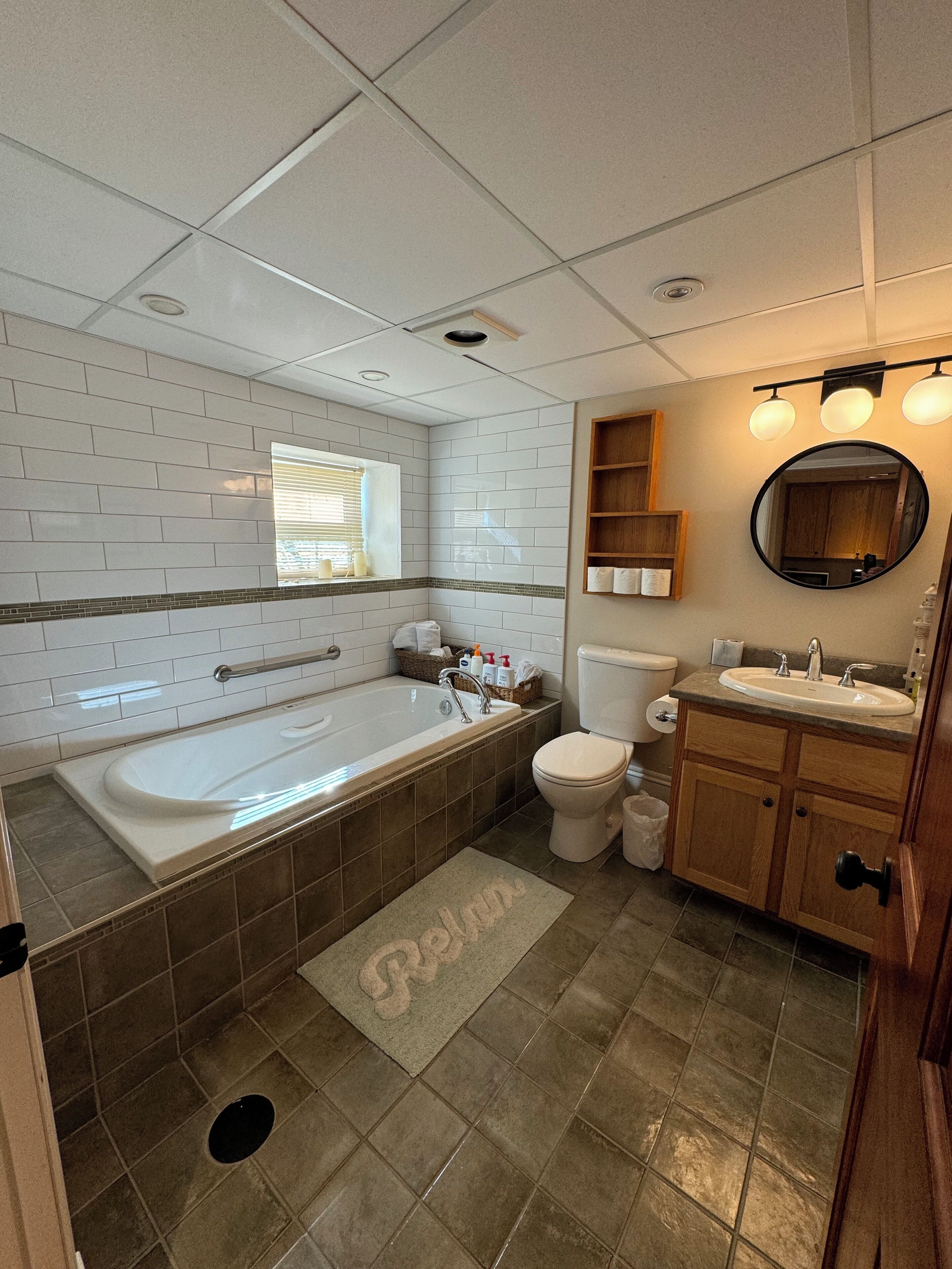 Jetted bath, towels, soap, toilet paper