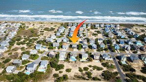 An aerial view of a coastal residential area with houses, some with visible swimming pools, and a beach in the background. - Sea Time - Corolla, Ocean Sands, Oceanside Retreat, 280 Yds to Beach, Close to Golf and Shopping (Corolla)