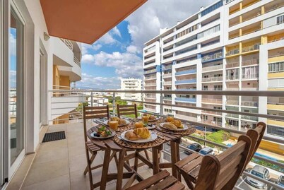 Sunlit Poolside Retreat w/ Balcony by HostWise