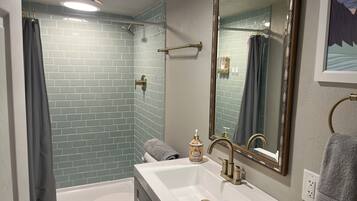 Shower, hair dryer, towels, soap