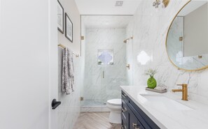 Shower, hair dryer, towels, soap
