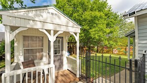 A white wooden structure with a porch, a door, and a window. - Walk to Eats & Shops • Decatur Courthouse View (Decatur)