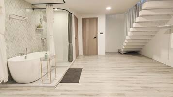 Separate bathtub and shower, free toiletries, hair dryer, slippers