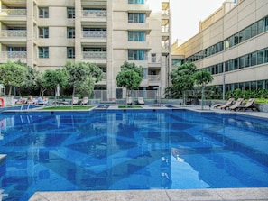 Outdoor pool, pool umbrellas, sun loungers