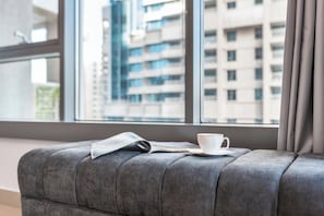 Deluxe Apartment, 1 Bedroom, Balcony, City View | Living area | 43-inch flat-screen TV with satellite channels, Netflix