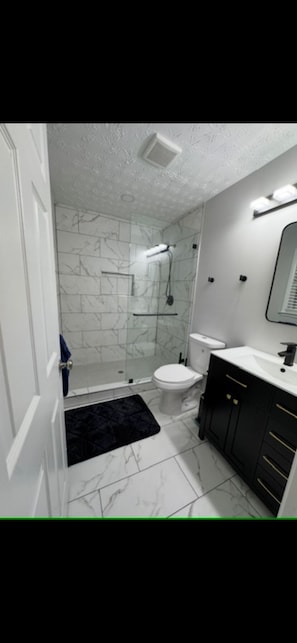 Shower, eco-friendly toiletries, hair dryer, towels
