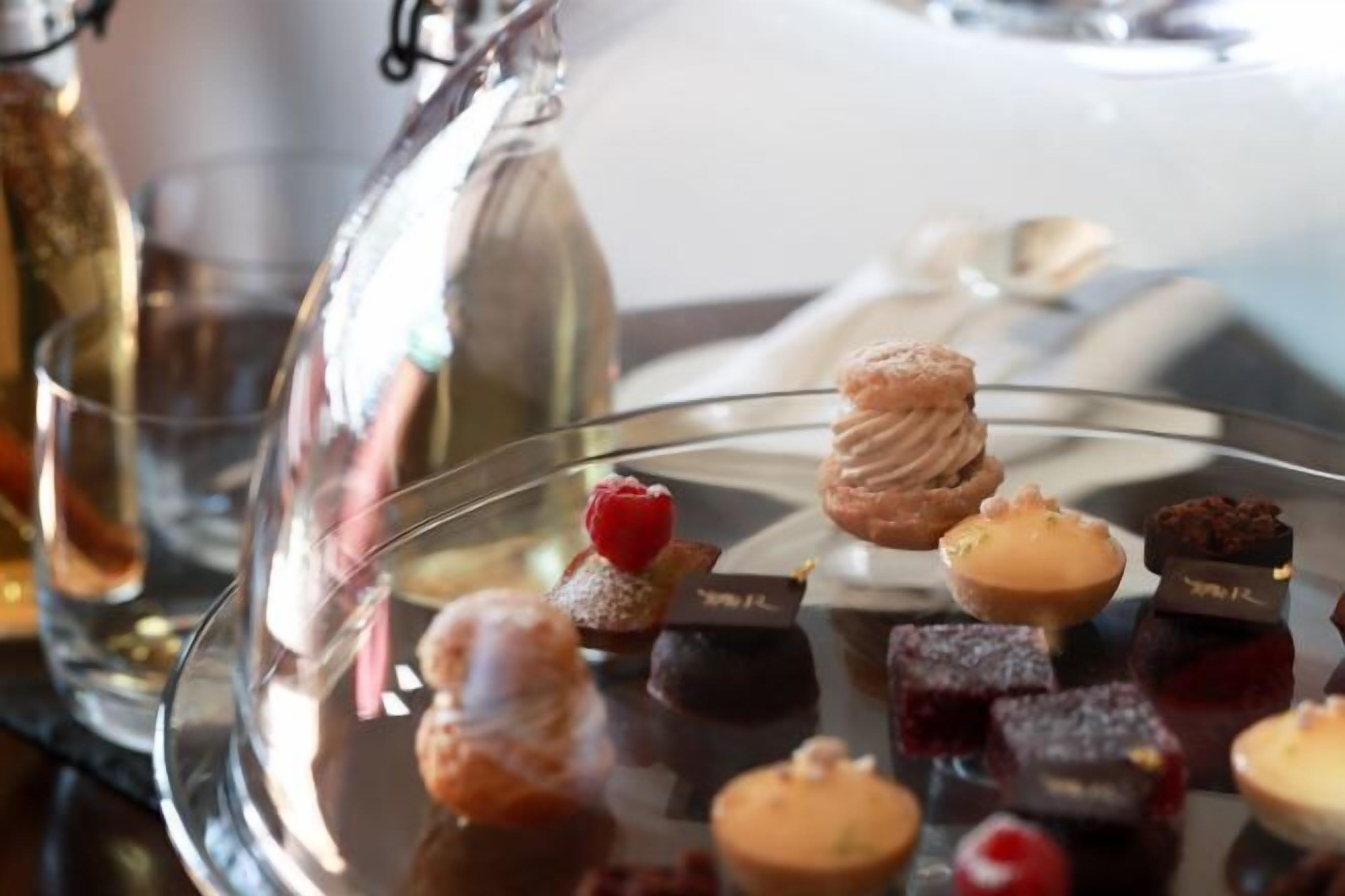 A dessert display with various pastries and chocolates.