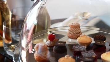 A dessert display with various pastries and chocolates.