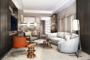 Ein modernes Wohnzimmer mit einer Couch, einem Couchtisch und einem orangefarbenen Sessel.