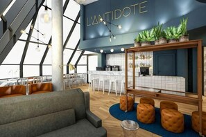 Un interior moderno con una zona de bar, asientos y un ventanal grande.