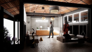 A modern reception area with a wooden ceiling, a reception desk, and a seating area with a swing.
