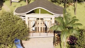 A resort with a large slide, palm trees, and a building with a curved roof.