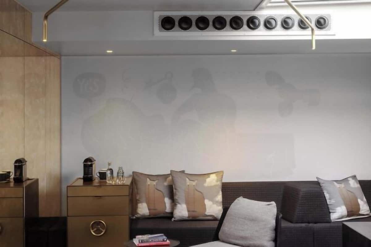 A modern living room with a sofa, a coffee table, and a cabinet.