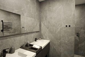 A modern bathroom with marble walls, a large mirror, dual sinks, and a towel rack. - 110m2 3bd Luxury last Paganini apt in Old Nice (Nice)