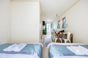 A hotel room with two beds, a desk, and a chair. - CROWN OOJIMA (Tokyo)