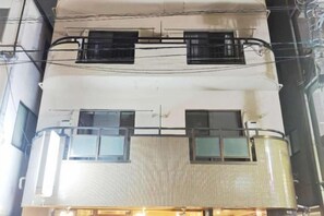 A multi-story building with balconies and windows. - SUMMERSONG (Tokyo)