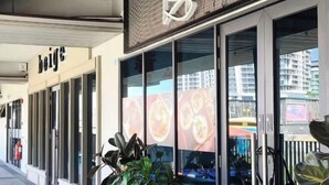 A storefront with a sign reading "beige" and large windows displaying food images. - Jesselton Quay Central Citypad (Kota Kinabalu)