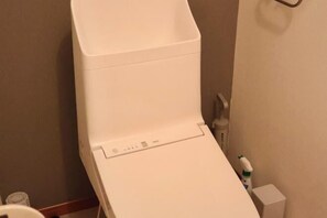 A white, empty, single-bed room with a small bedside table and a wall-mounted shelf. - Orange House Tsuruhashi|With Garage, Accommodates 8 People (Osaka)
