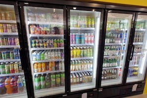 Refrigerated beverage dispensers stocked with various drinks. - H&W Sunway Onsen Suite S-13-05 near Lost World of Tambun Ipoh (Ulu Kinta)