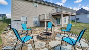 A house with a deck, outdoor seating, and a fire pit. - Bar, Pool Table & Yard! Spacious Union Home (Union)