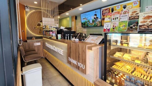 A coffee shop counter with a 'THANK YOU' sign, a menu board, and a display case with pastries. - Irich residence (South Samrong) 6 Kms BTS-Pu Chao (Phra Pradaeng)