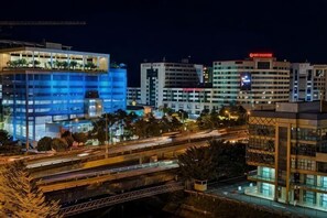 A multi-story hotel with a modern design, featuring a rooftop garden and a prominent sign. - South China Sea Place Suites by Kinabina Homestay (Kota Kinabalu)